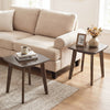 Solid wood square side table in walnut finish with curved edges, perfect for lamps and snacks beside a sofa.