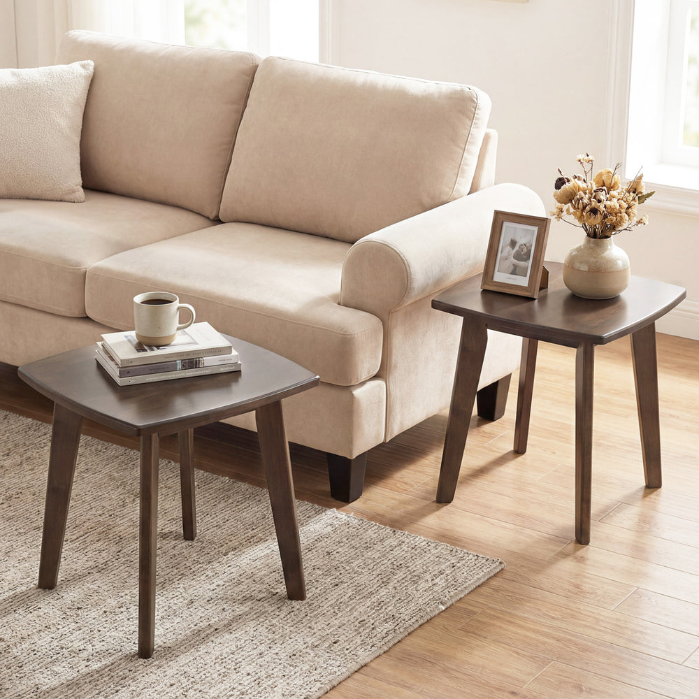 Solid wood square side table in walnut finish with curved edges, perfect for lamps and snacks beside a sofa.