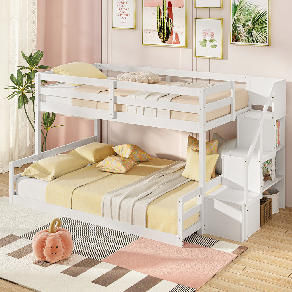 Solid wood twin over full low bunk bed in white with storage stairs, ideal for kids' rooms and dormitories.