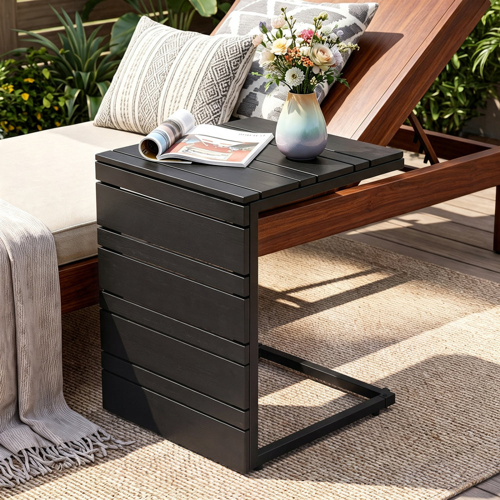 C-shaped black side table with a slatted wood-plastic top, ideal for convenient use in living rooms or patios.
