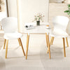 Square dining table with white surface and wooden legs, featuring adjustable foot pads for stability in small spaces.