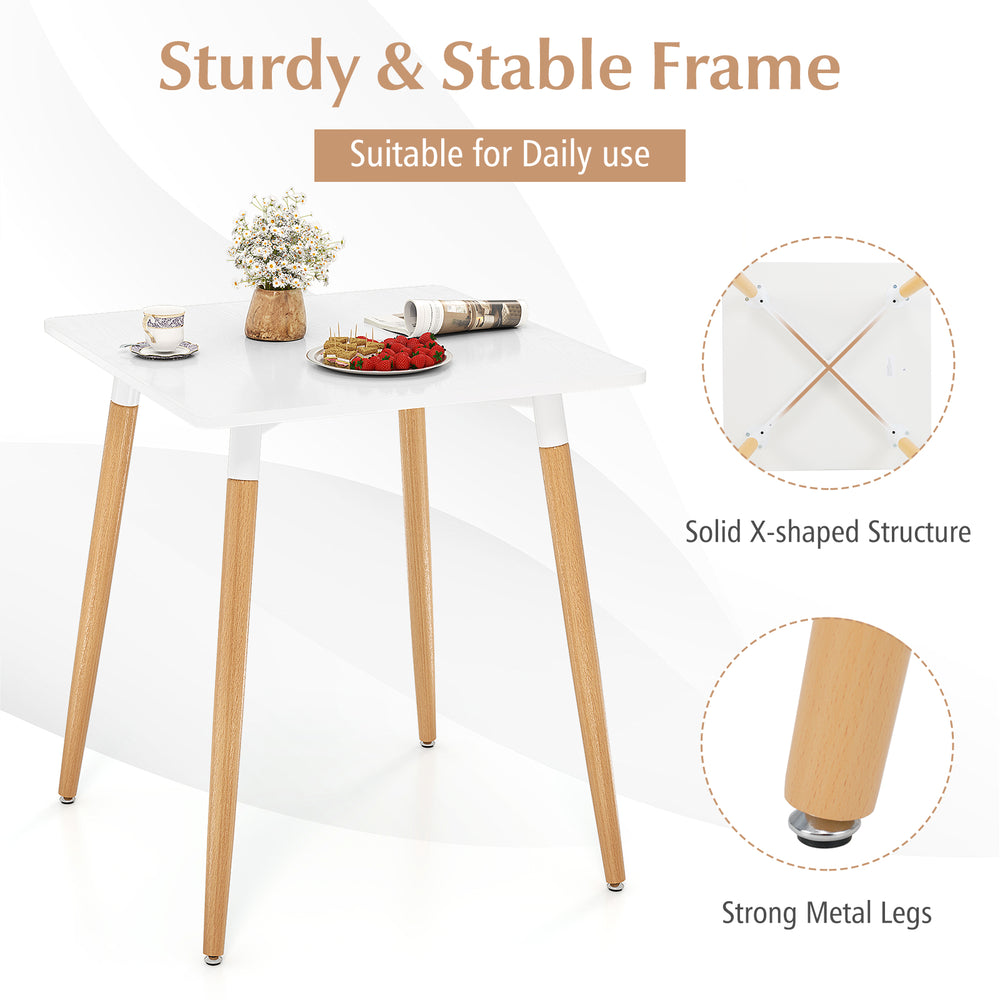 Square dining table with white high-density board top and wooden legs, featuring adjustable foot pads for stability.