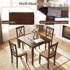 Square kitchen table with smooth edges and reinforced triangular supports, accompanied by four armless chairs in walnut.