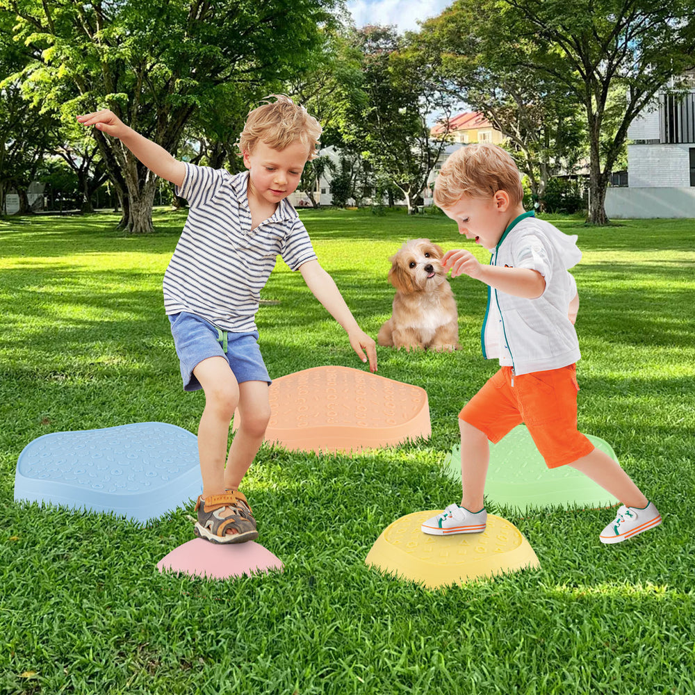 Colorful non-slip balance stones for kids, promoting play and coordination in outdoor settings. Ideal for ages 3+.