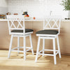 Set of two white swivel bar stools with gray upholstered seats, perfect for counter height dining areas.