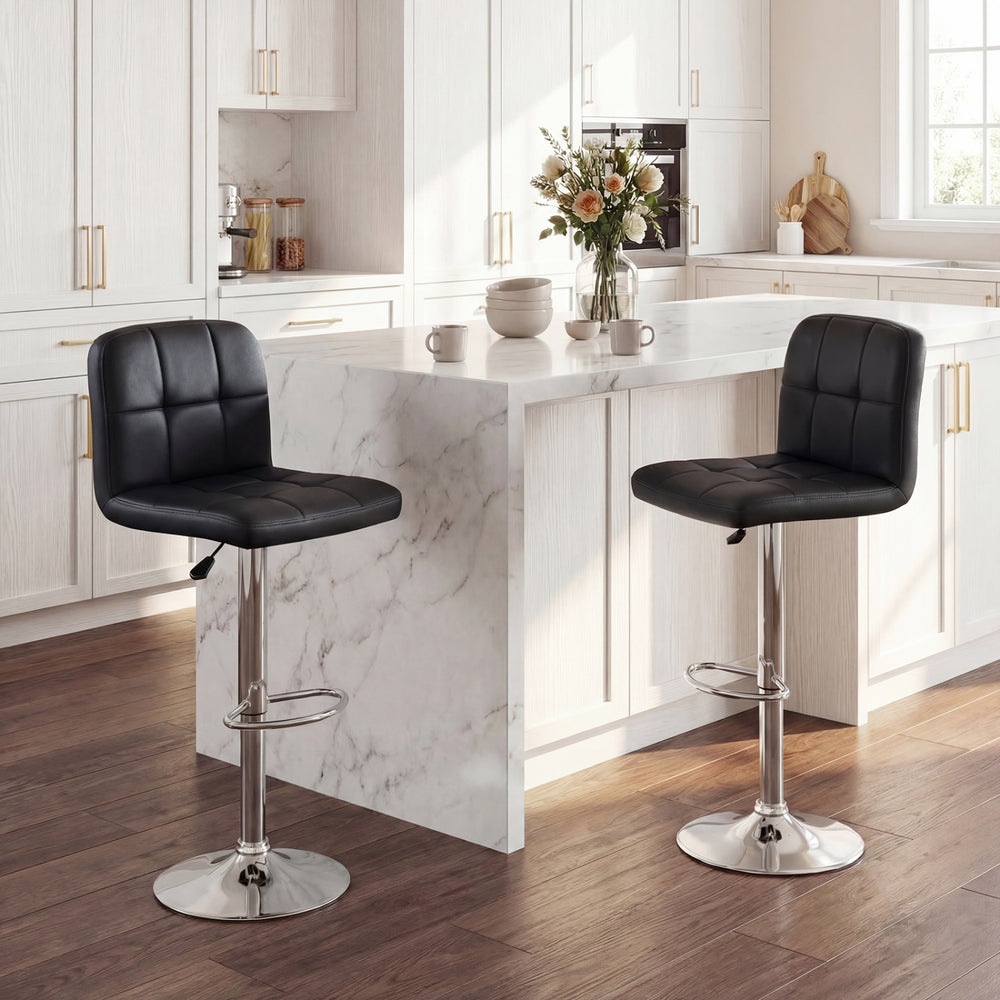 Set of 2 black swivel bar stools with adjustable height, footrests, and metal bases, perfect for kitchen or dining.