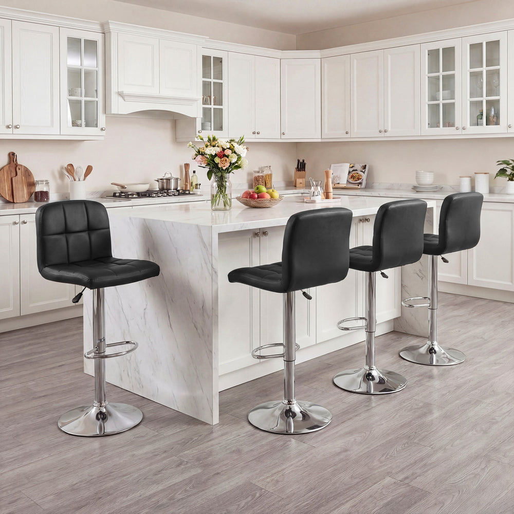 Black swivel bar stool with adjustable height and footrest, perfect for kitchen or dining room use.