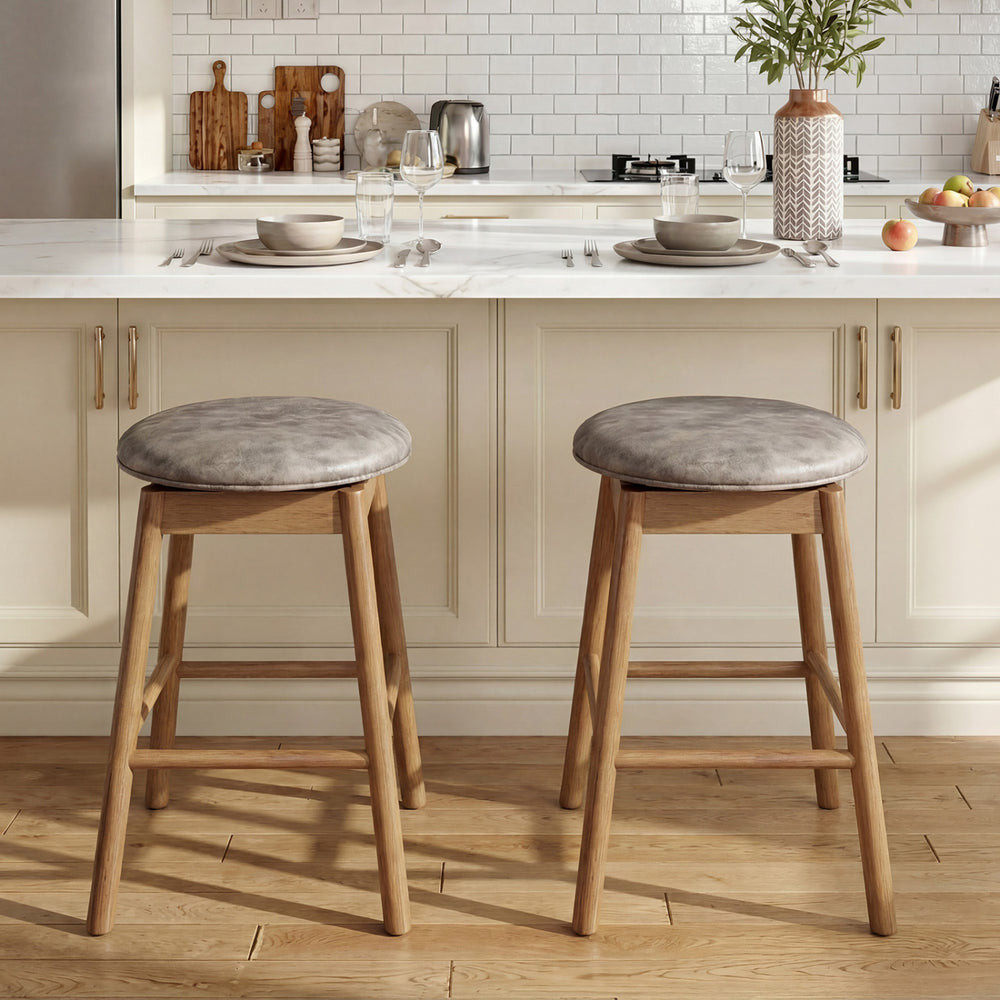 Set of 2 swivel counter height barstools with solid wood legs and PU leather seats, ideal for kitchen islands or home.
