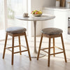 Backless swivel counter height barstools with solid wood legs, featuring PU leather seats and built-in footrests for.