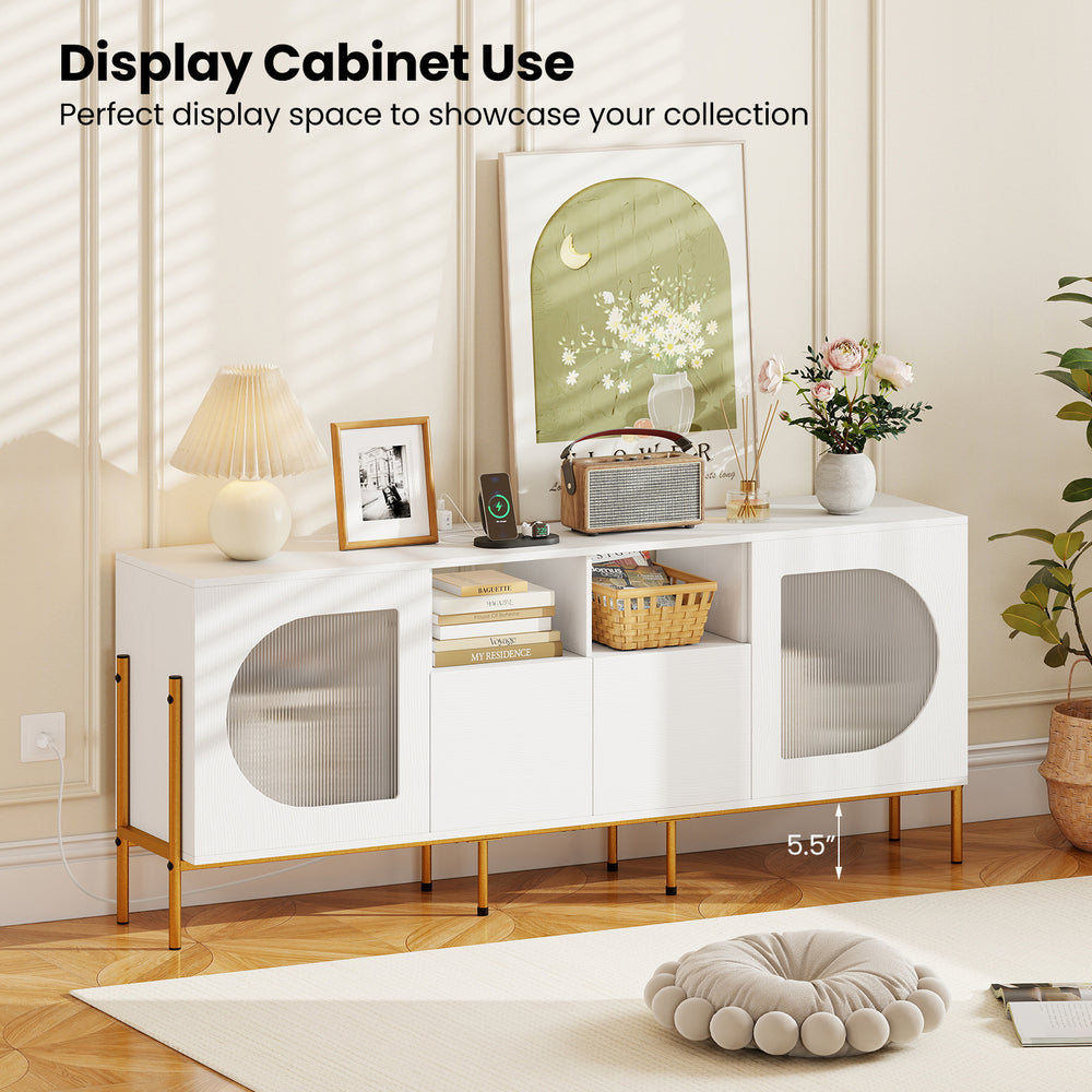 White TV stand with wavy cabinet doors, open shelves, and power outlets, ideal for showcasing decor and media equipment.