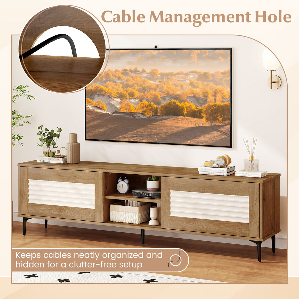 Cable management hole on the oak TV stand for TVs up to 70 inches, ensuring a tidy and organized setup.