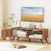 Mid-century modern TV stand in oak with 5 raised legs, showcasing open storage for media items and a stylish design.