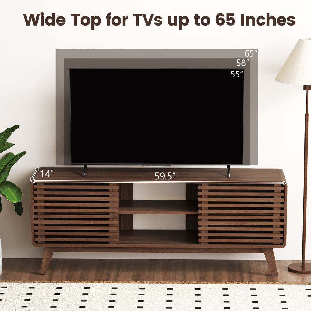 Walnut TV stand with sliding doors, adjustable shelves, and splayed rubber wood legs for TVs up to 65 inches.