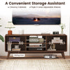 Walnut TV stand with sliding doors, adjustable shelves, and splayed rubber wood legs for TVs up to 65" in living room.