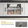 Close-up of the TV stand's cable management holes, designed to keep wires organized for a clean look.