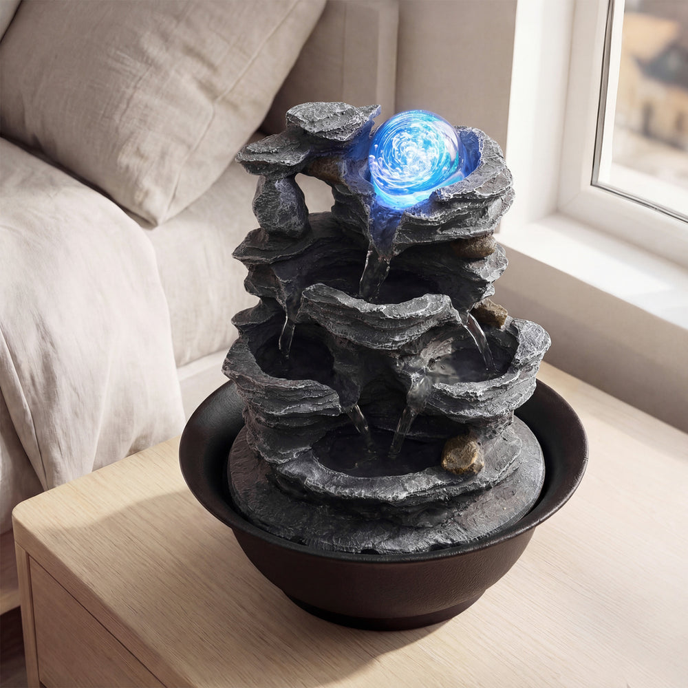 Tabletop water fountain displaying a side view of the tiered design and rolling crystal ball, perfect for desk.