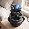 Tabletop water fountain showcasing the serene tiered design and tranquil water flow, perfect for compact spaces.