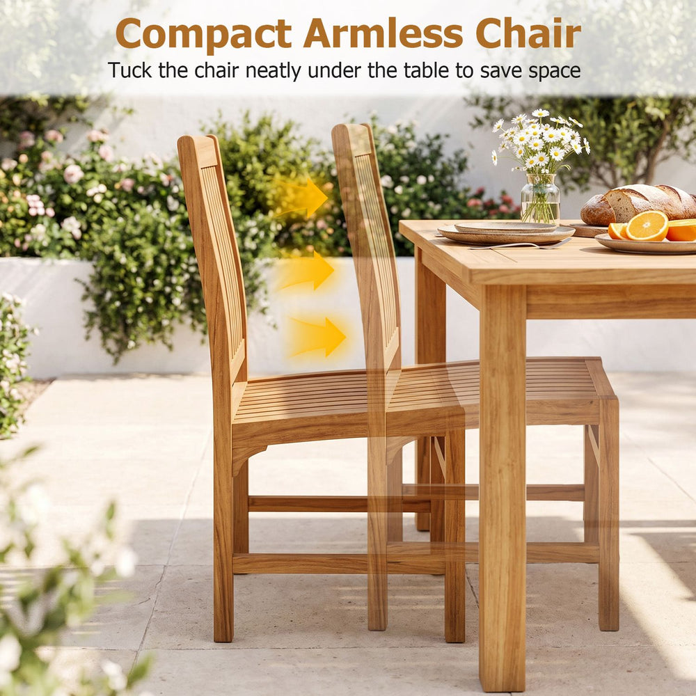 Teak wood armless dining chairs with slatted seats tuck neatly under a table to save space.