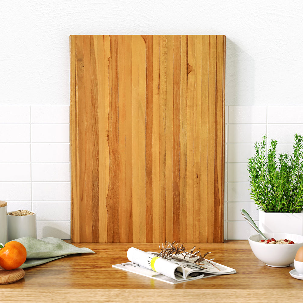 Extra large 24" teak wood cutting board with smooth finish, ideal for cutting, serving, and enhancing kitchen.