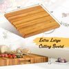 Extra large 24" teak wood cutting board showcasing smooth surfaces and sturdy 1.5" thickness, ideal for versatile meal.
