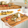 Extra large 24" teak wood cutting board with handy cut-out handle, perfect for serving and versatile kitchen use.