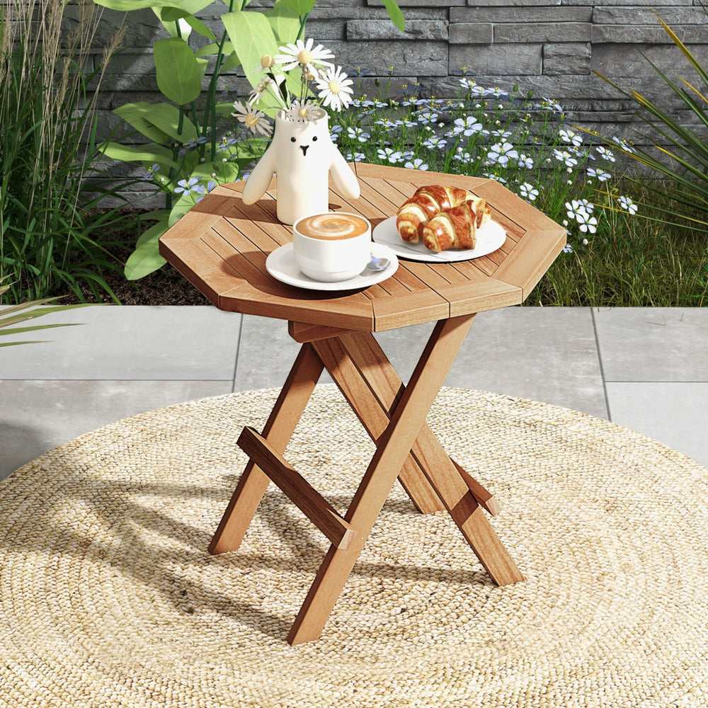 Teak wood octagon coffee table with slatted tabletop and X-shaped legs, perfect for outdoor camping or backyard use.