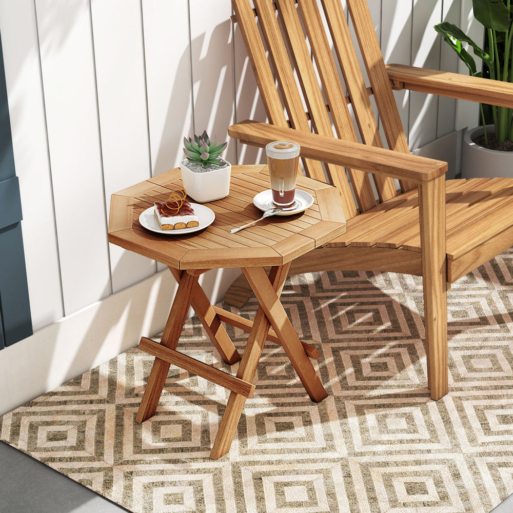 Teak wood octagon coffee table with slatted tabletop and X-shaped legs, perfect for outdoor use and space-saving.