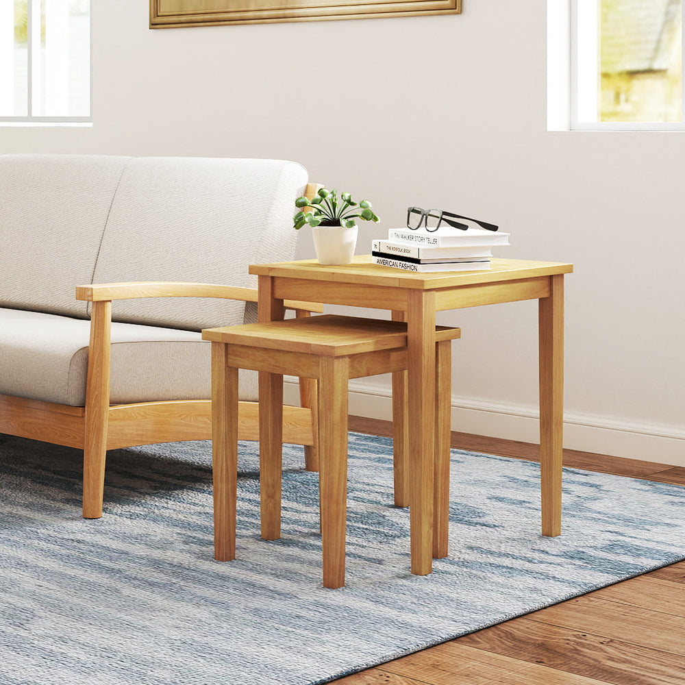 Teak wood nesting tables with natural texture, perfect for versatile arrangements in living rooms or outdoor patios.