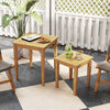 Teak wood outdoor patio nesting tables in a space-saving design, perfect for versatile arrangements by the poolside.