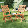 Teak wood folding dining chairs with slatted seats, perfect for camping or backyard relaxation.