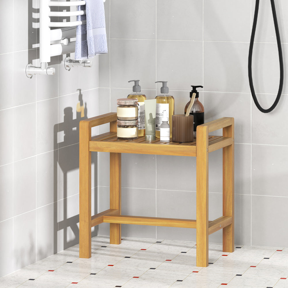 Teak wood shower bench with slat top and side handles, ideal for storage and seating in humid bathroom environments.