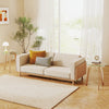 Round end table with tempered glass top and solid rubber wood legs, ideal for living room or bedroom use.