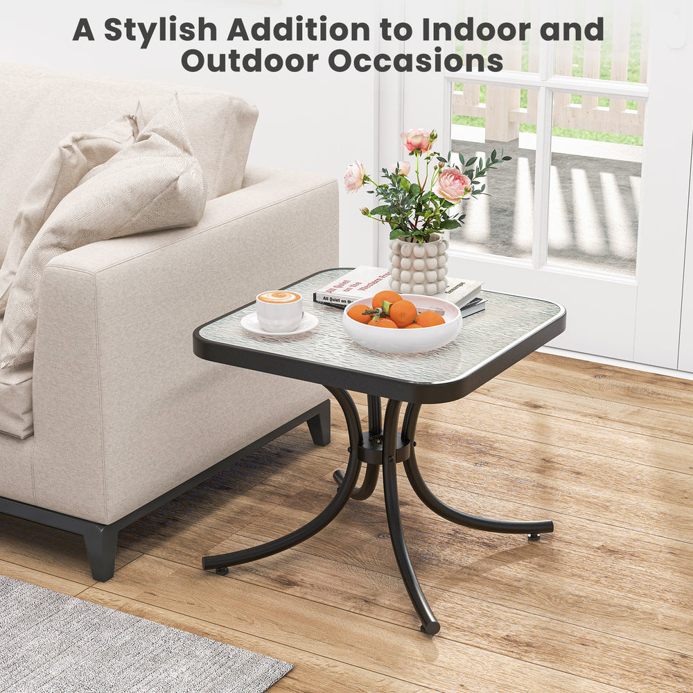 Tempered glass top patio table with heavy-duty metal frame, perfect for indoor and outdoor use in gardens or poolside.