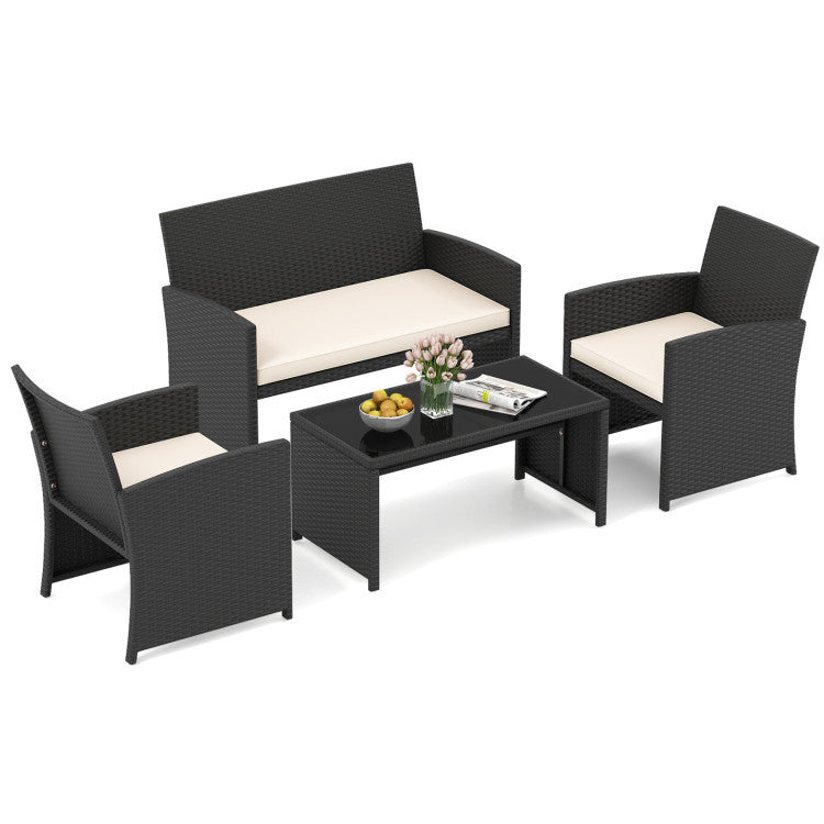4-piece rattan lounge set with cream cushions and tempered glass table, ideal for outdoor patios and gardens.