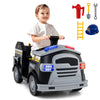 Toddler riding a black 12V fire toy car with accessories like a shovel, wrench, and safety hat for imaginative play.