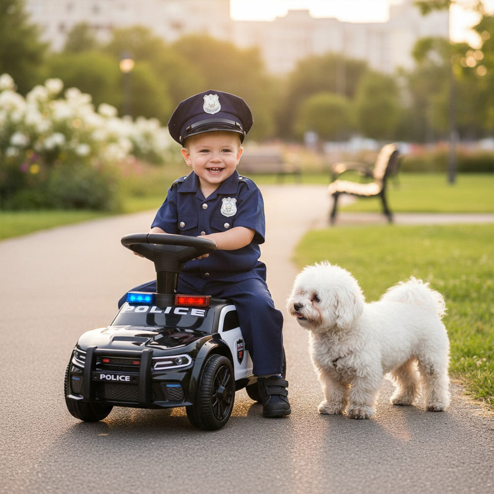 Toddler sliding car in black with police lights and steering wheel, featuring under-seat storage for fun outdoor play.