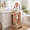 Toddler standing tower with adjustable height, colorful toys, and detachable chalkboard for safe, creative play.