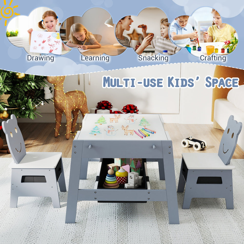 Grey toddler table and two chairs set with reversible chalkboard and whiteboard, ideal for art and learning activities.
