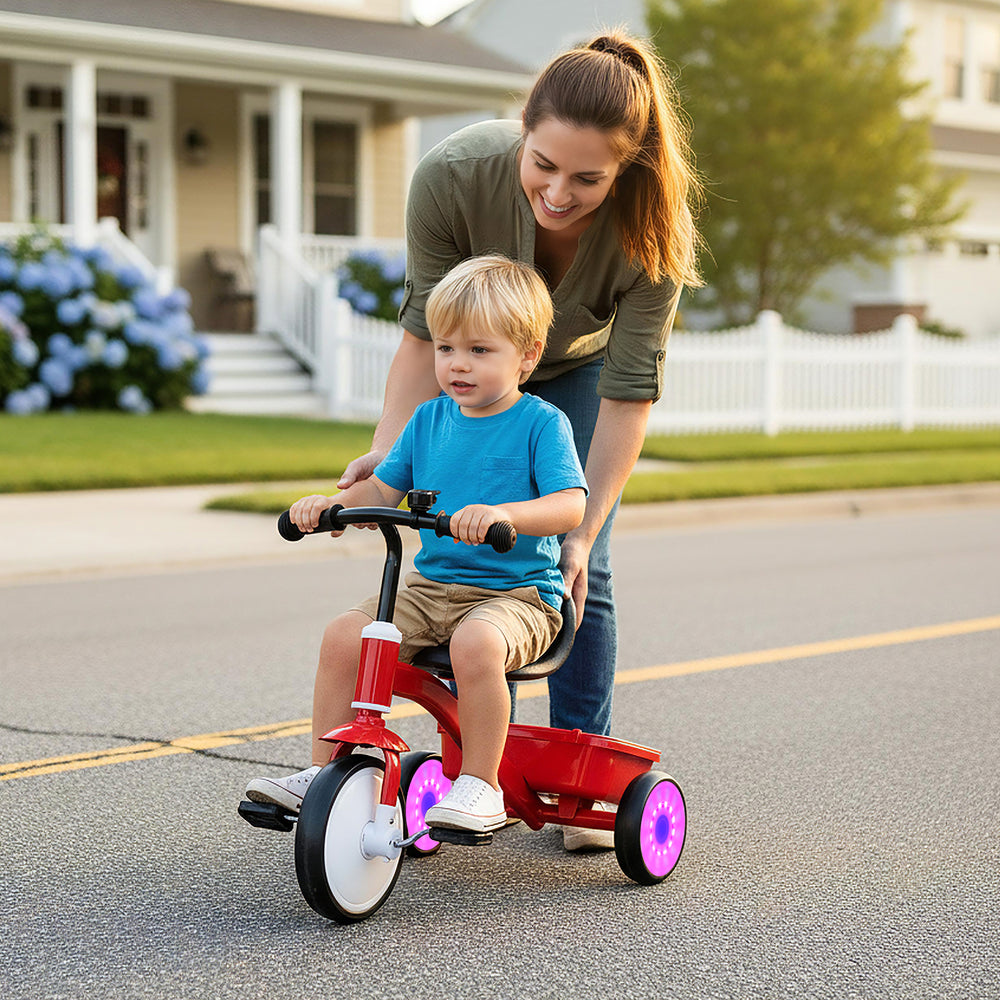 Toddler tricycle with glowing wheels, adjustable seat, and rear storage bin for fun outdoor playtime.