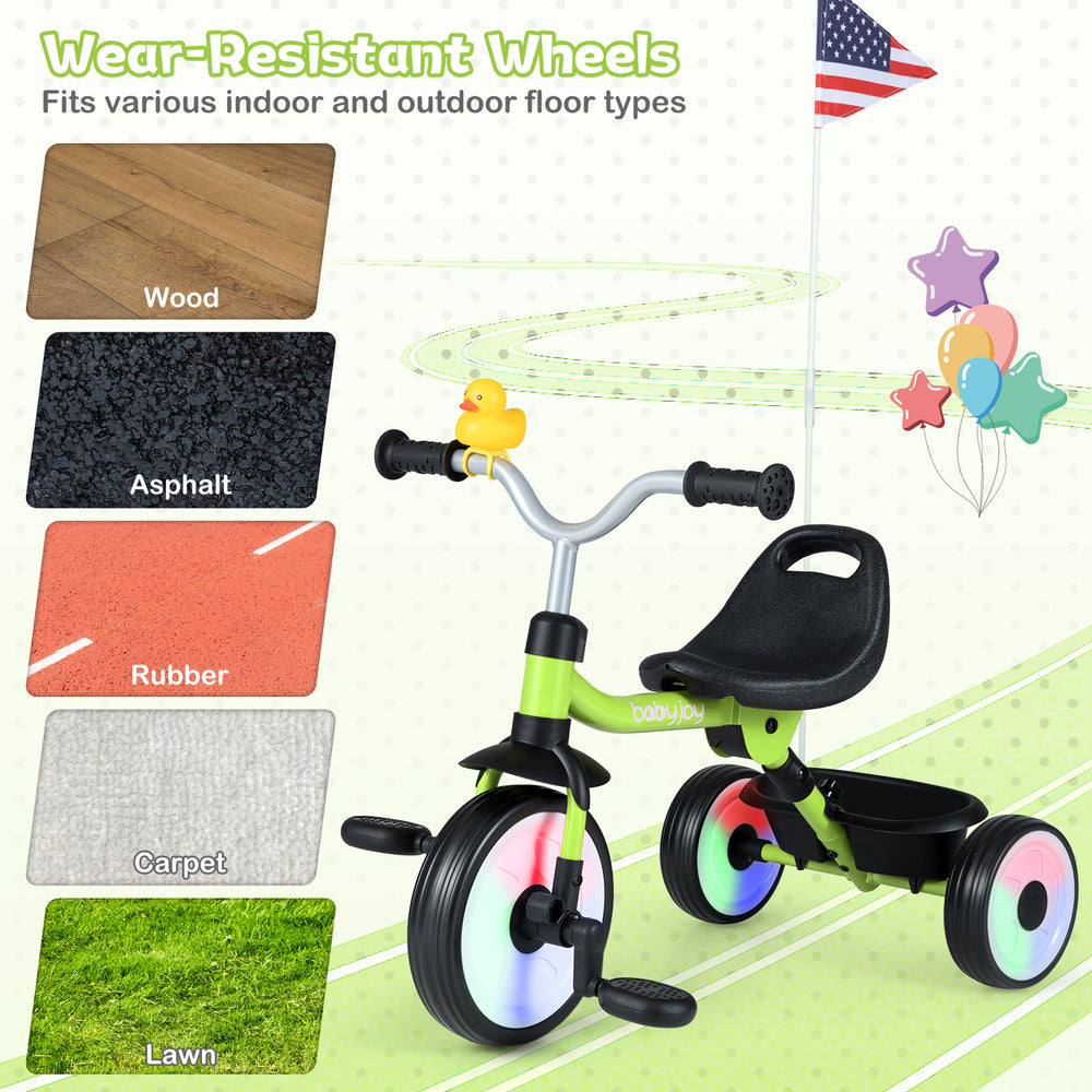 Toddler tricycle in green with glowing wheels, adjustable seat, and storage basket, suitable for various surfaces.