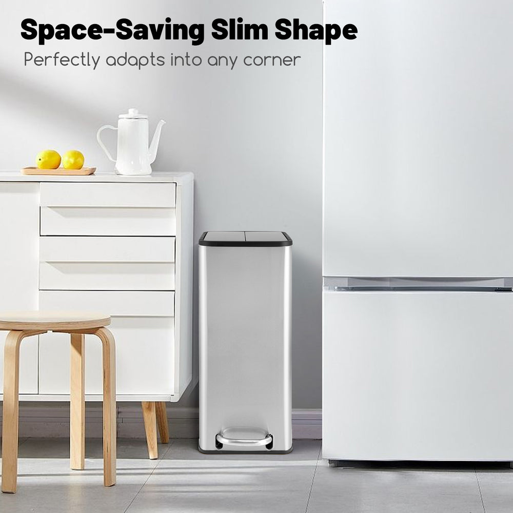 Slim stainless steel trash can with soft-closing lids, ideal for kitchen corners and easy access under countertops.