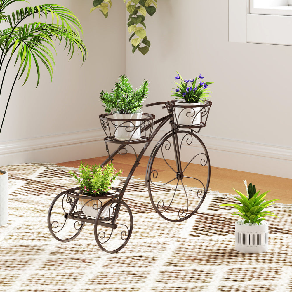 Bronze tricycle plant stand with U-shaped handlebar and three hollowed baskets, perfect for stylish indoor or outdoor.