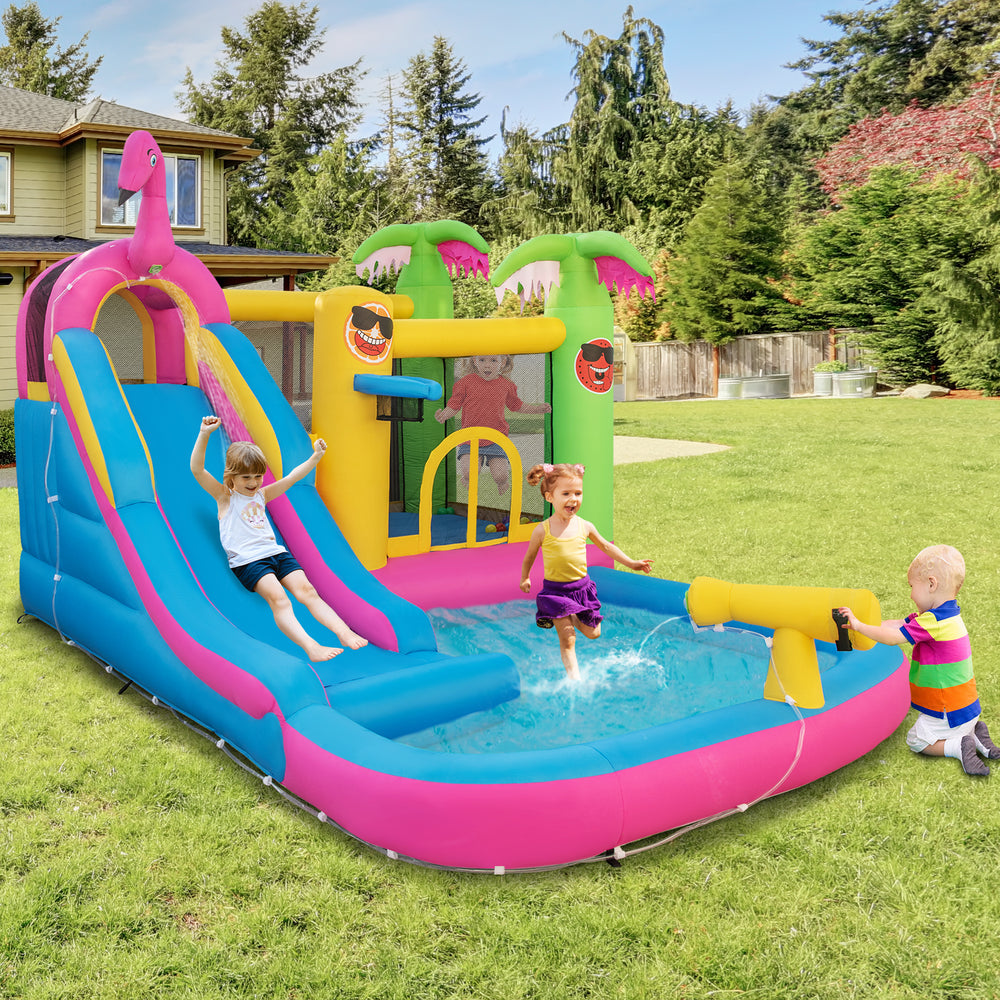 Inflatable bounce castle with water slide, featuring vibrant colors and a water gun, perfect for summer fun in the.