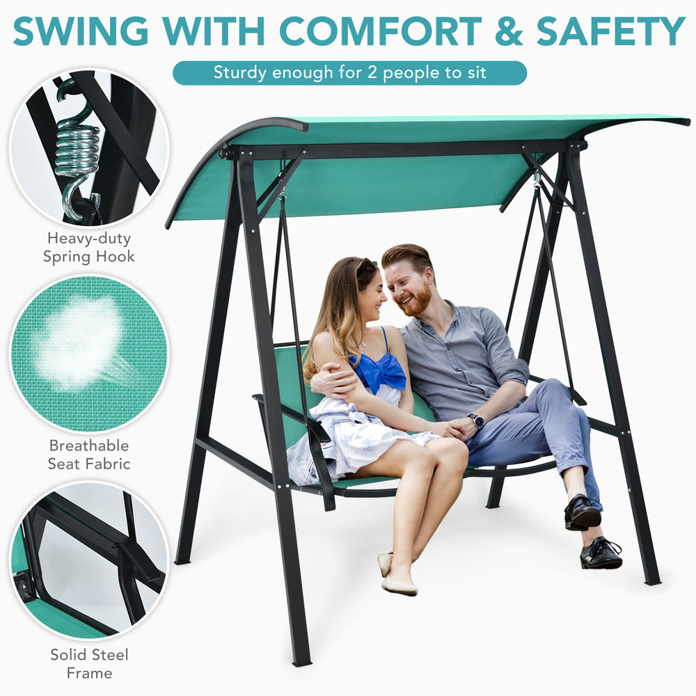 Two-person patio swing in green with adjustable canopy, sturdy steel frame, perfect for outdoor relaxation.