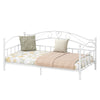 Twin size metal daybed frame in white with heart-shaped design, featuring floral bedding and pillows for cozy bedroom.