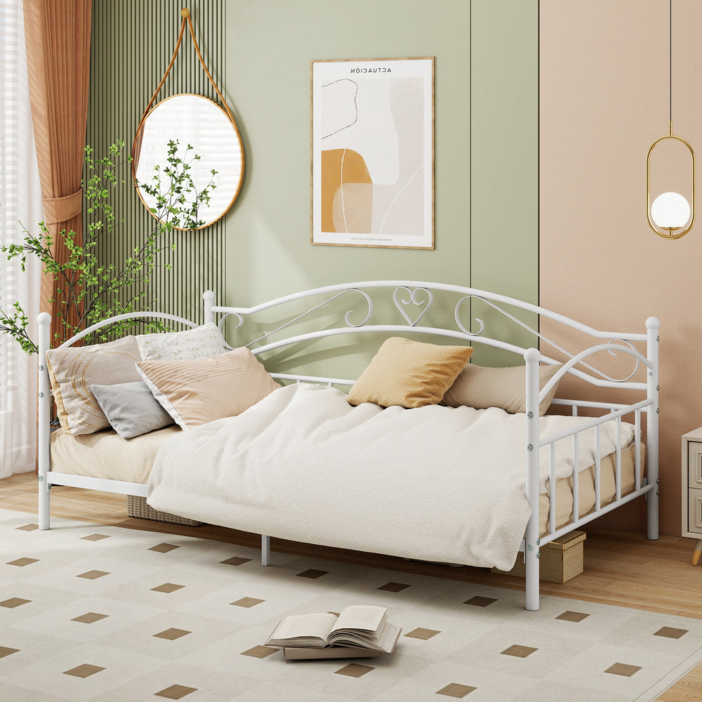 Twin size metal daybed frame in white with heart-shaped decoration, perfect for cozy seating and extra sleeping space.