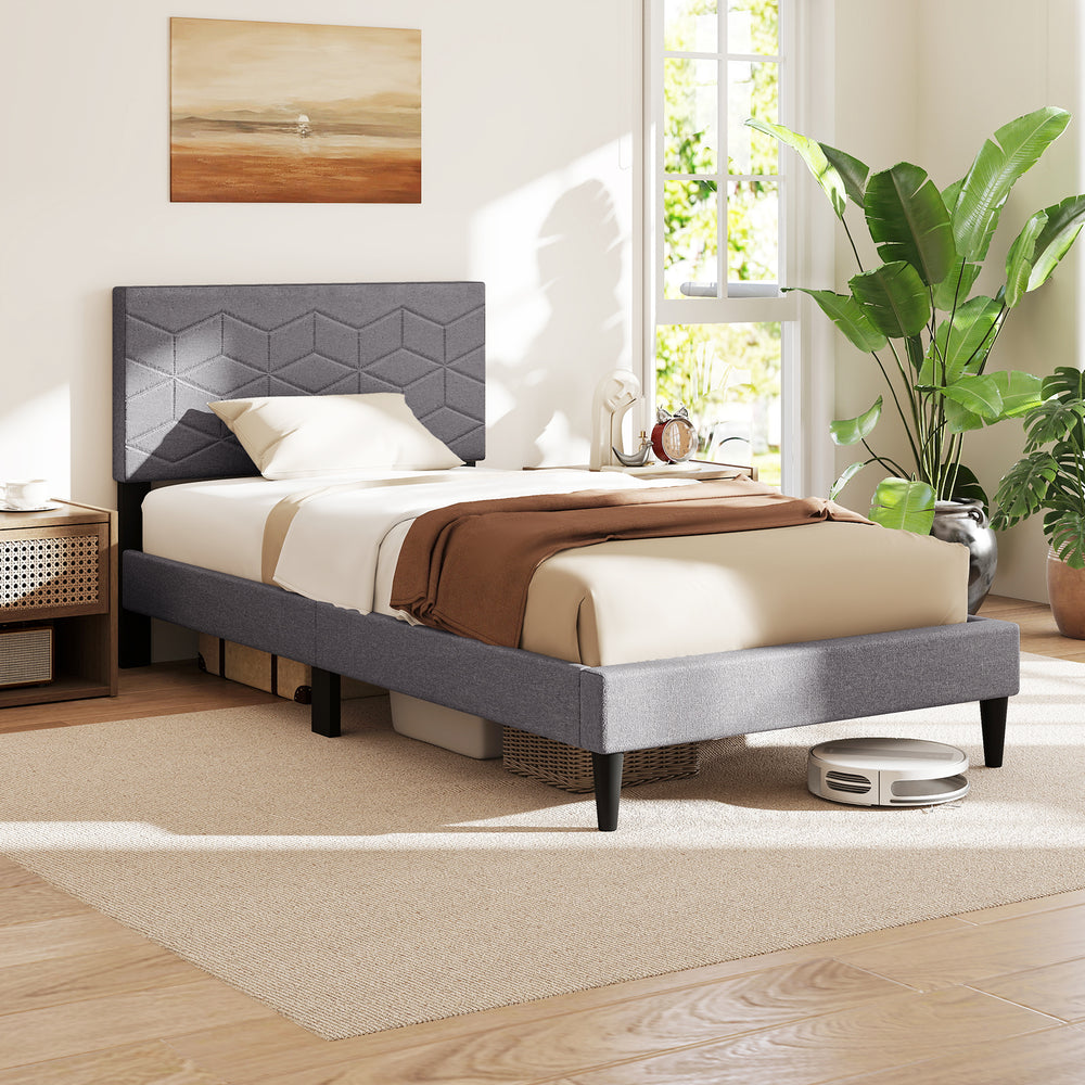 Modern twin bed frame with upholstered headboard, geometric quilting, and breathable linen fabric for stylish comfort.