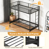 Twin over futon bunk bed in black with sturdy metal structure and safety guardrails, ideal for guest rooms or dorms.