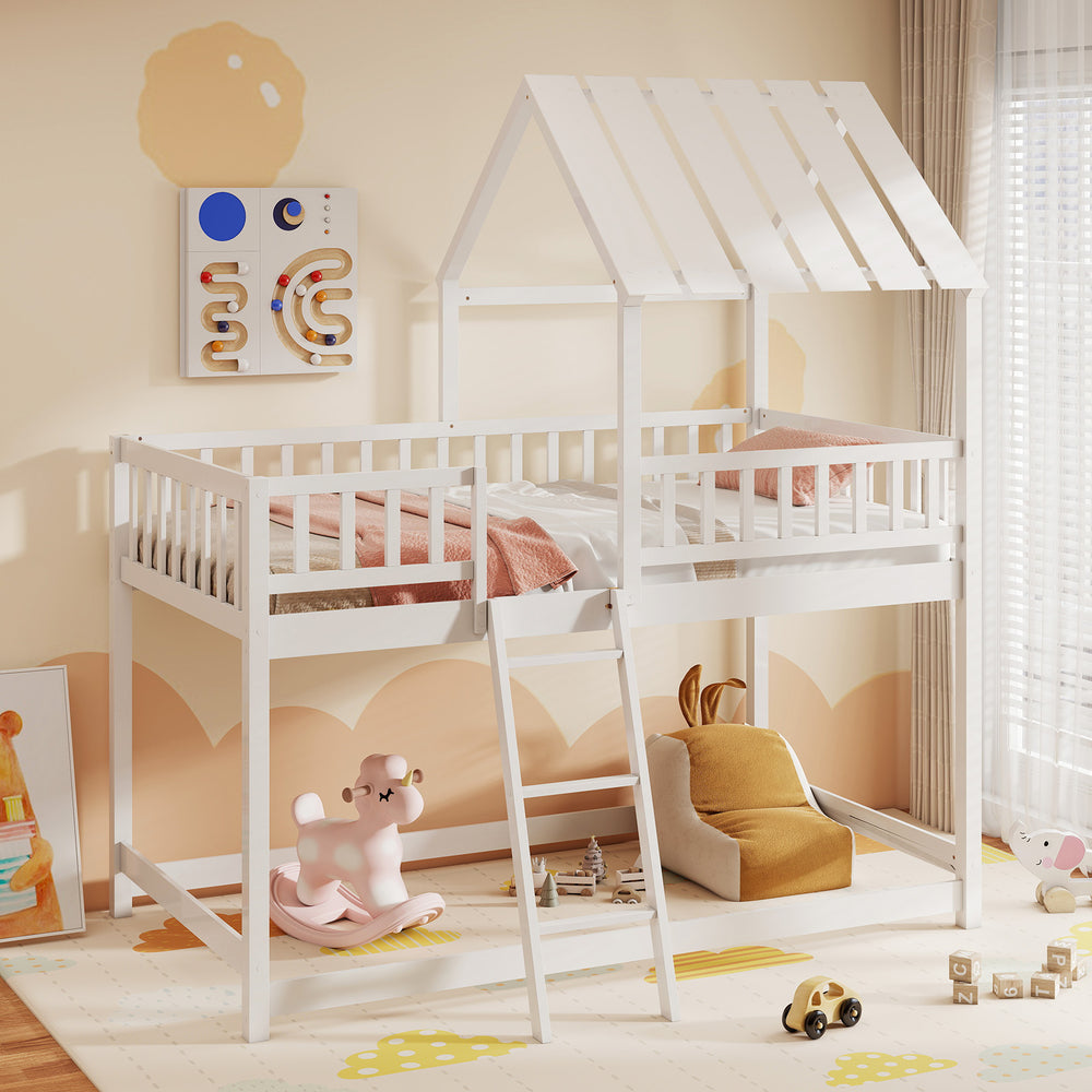 House-shaped twin over twin bunk bed in white with a solid pine frame and low-to-ground design for easy access for kids.