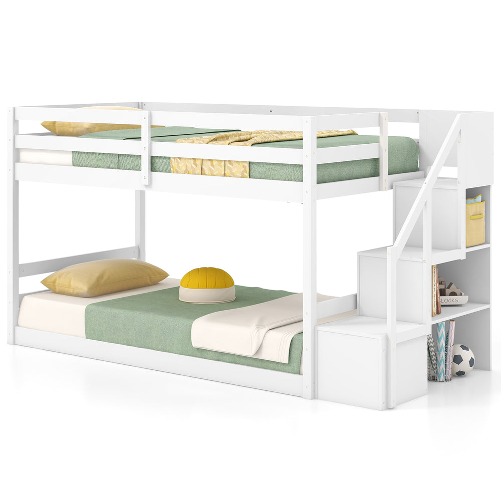 Twin over twin low bunk bed in white with storage stairs and open compartments for kids' organization and safety.